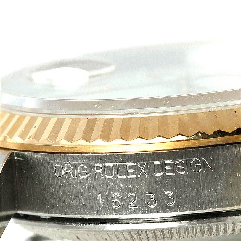 The image shows a close-up of the case side and fluted bezel of a Rolex Datejust 16233 Men's Steel and Gold (two tone) Beige Dial 16233 Men's Steel and Gold (two tone) Beige Dial watch.