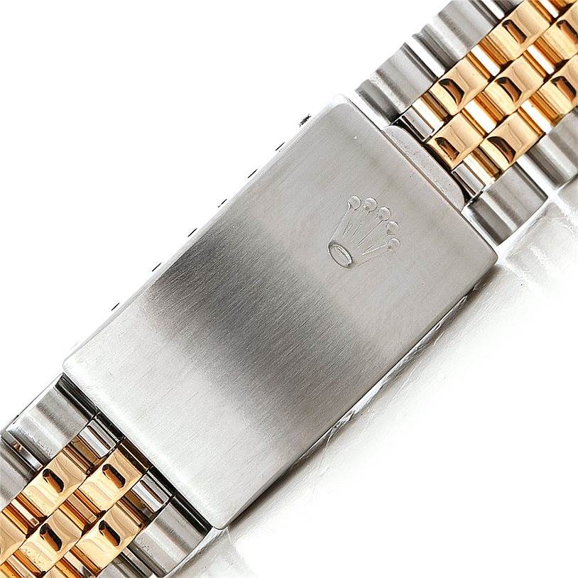 The image shows the clasp and part of the bracelet of a Rolex Datejust 16233 Men's Steel and Gold (two tone) White Dial 16233 Men's Steel and Gold (two tone) White Dial watch, featuring a two-tone metal finish.