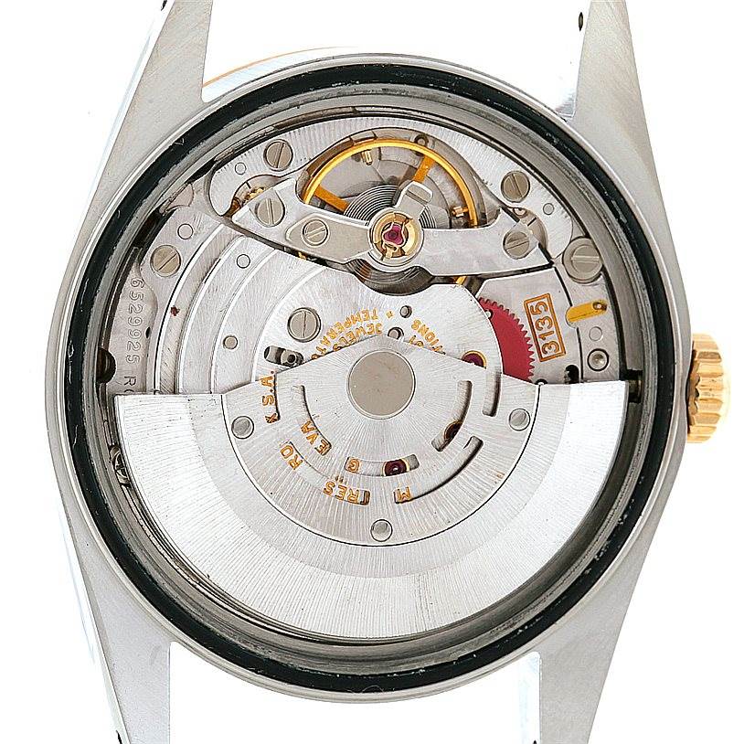 The image shows the inner mechanism and movement of a Rolex Datejust 16233 Men's Steel and Gold (two tone) White Dial 16233 Men's Steel and Gold (two tone) White Dial watch.