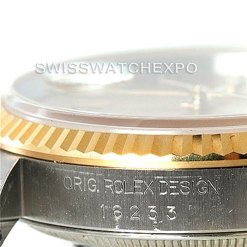 This close-up image of a Rolex Datejust 16233 Men's Steel and Gold (two tone) Champagne Dial 16233 Men's Steel and Gold (two tone) Champagne Dial watch shows the side, highlighting the fluted bezel and part of the case.