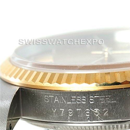 The image shows a close-up side view of the stainless steel case, fluted bezel, and part of the face of a Rolex Datejust 16233 Men's Steel and Gold (two tone) Champagne Dial 16233 Men's Steel and Gold (two tone) Champagne Dial watch.