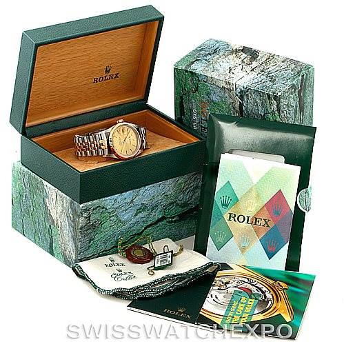 This image shows a Rolex Datejust 16233 Men's Steel and Gold (two tone) Champagne Dial 16233 Men's Steel and Gold (two tone) Champagne Dial watch in an open box with its bracelet visible, along with various documents, tags, and accessories.