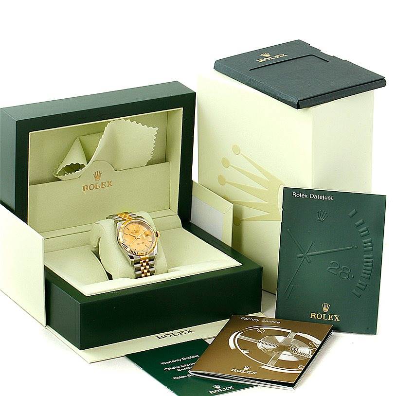 The image shows a Rolex Datejust 116233 Men
s Stainless Steel Champagne Dial 116233 Men
s Stainless Steel Champagne Dial watch in its box, with accompanying paperwork and accessories.