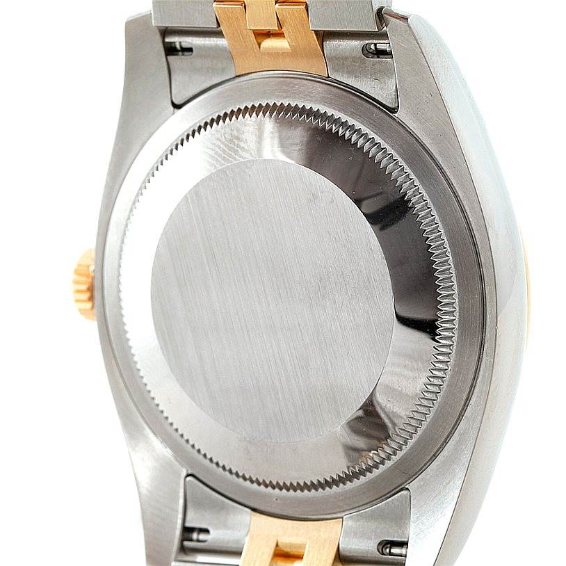 This image shows the case back and part of the bracelet of a Rolex Datejust 116233 Men
s Stainless Steel Champagne Dial 116233 Men
s Stainless Steel Champagne Dial watch.