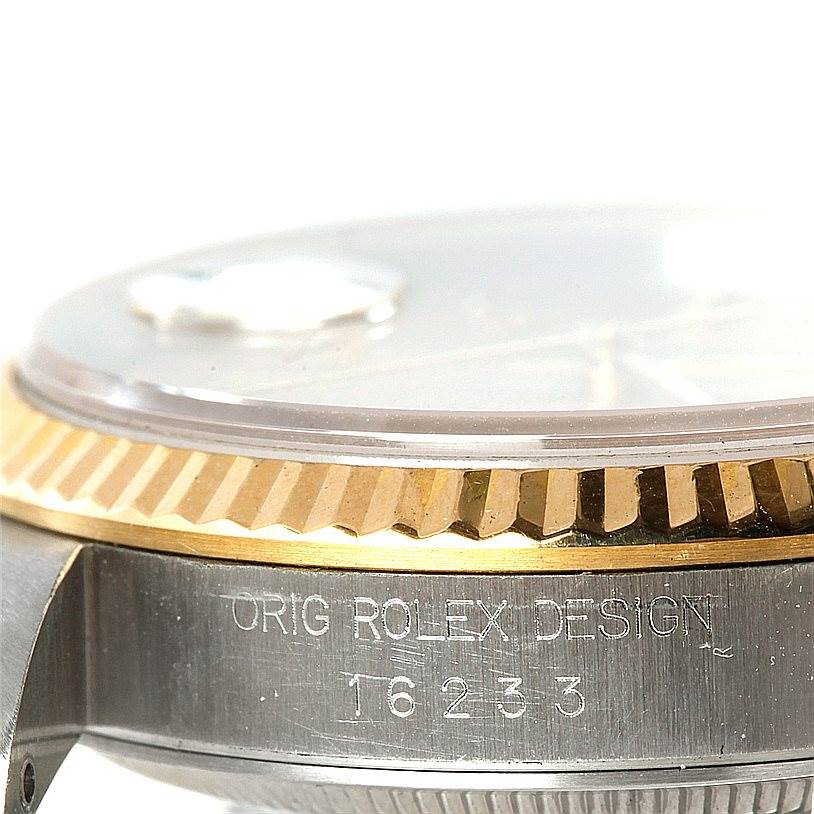 This image shows a close-up side view of the bezel and case of a Rolex Datejust 16233 Men's Steel and Gold (two tone) Champagne Dial 16233 Men's Steel and Gold (two tone) Champagne Dial watch model 16233.