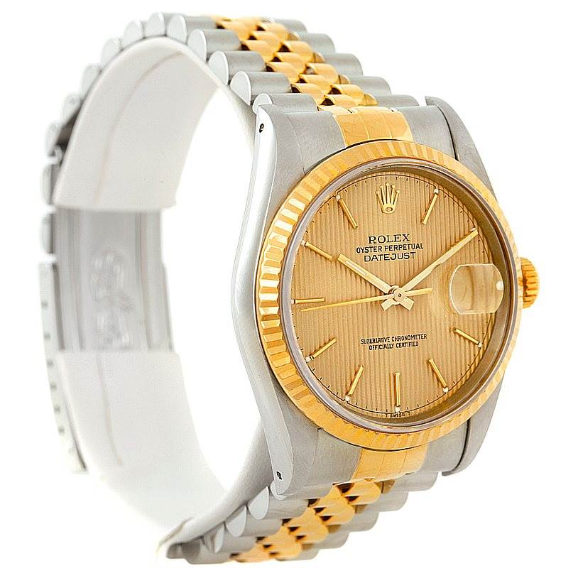 The image shows a side-angle view of a Rolex Datejust 16233 Men's Steel and Gold (two tone) Champagne Dial 16233 Men's Steel and Gold (two tone) Champagne Dial watch, highlighting its two-tone bracelet and champagne dial.