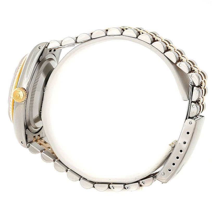 The image shows the side profile of a Rolex Datejust 16233 Men's Steel and Gold (two tone) Champagne Dial 16233 Men's Steel and Gold (two tone) Champagne Dial watch, highlighting its bracelet, crown, and clasp.