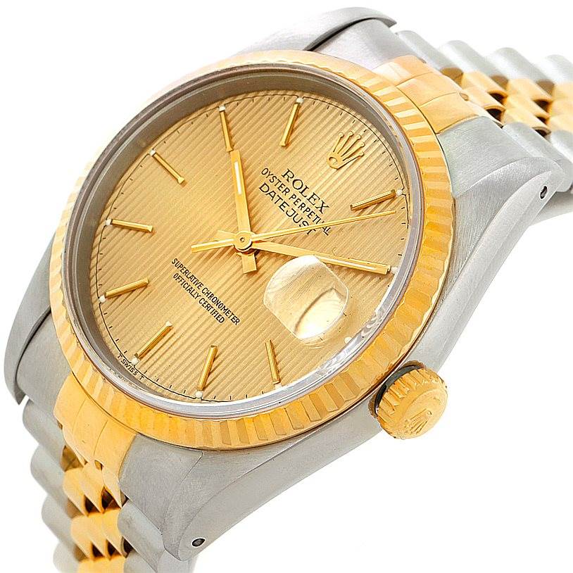 The image shows a side view of a Rolex Datejust 16233 Men's Steel and Gold (two tone) Champagne Dial 16233 Men's Steel and Gold (two tone) Champagne Dial model, highlighting the watch face, fluted bezel, crown, and part of the bracelet.