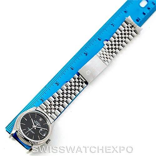 This image shows a top-down view of a Rolex Datejust 16234 Men's Stainless Steel Grey Dial 16234 Men's Stainless Steel Grey Dial watch with a ruler beside it, highlighting the watch's length.