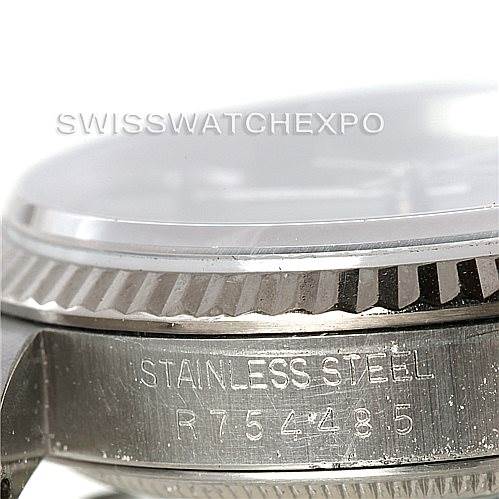 The image shows a close-up of the stainless steel case and fluted bezel of a Rolex Datejust 16234 Men's Stainless Steel Grey Dial 16234 Men's Stainless Steel Grey Dial watch from a side angle.