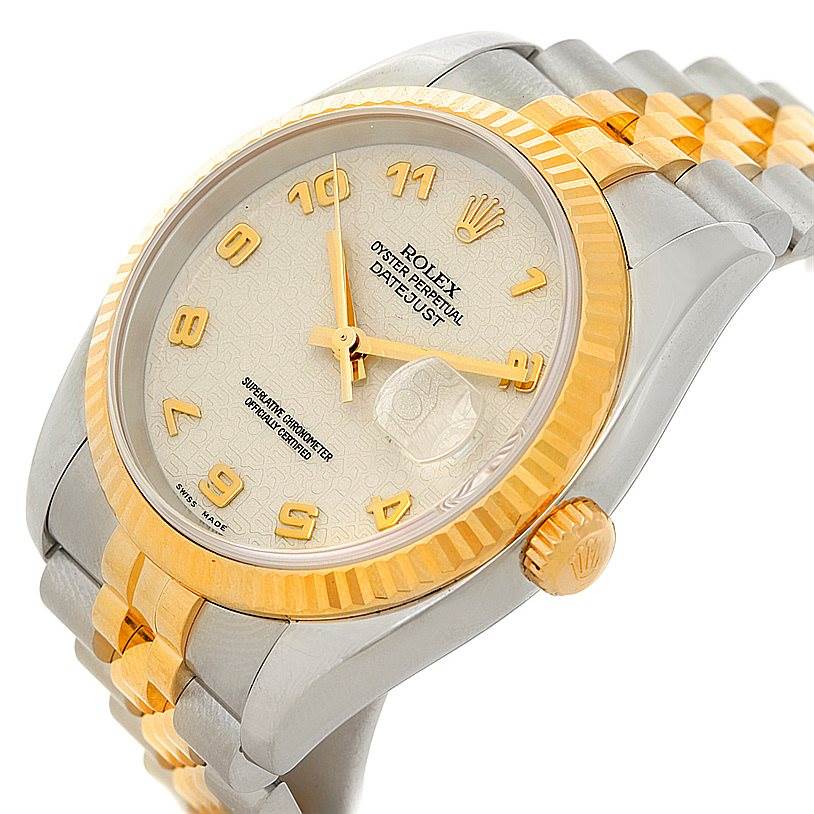 The Rolex Datejust 116233 Men's Stainless Steel Beige Dial 116233 Men's Stainless Steel Beige Dial watch is shown at an oblique angle, displaying its dial, bezel, and part of the bracelet.