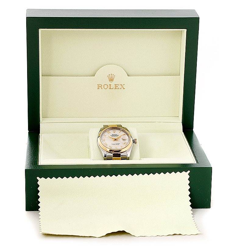 The image shows a Rolex Datejust 116203 Men's Stainless Steel Mother of Pearl Dial 116203 Men's Stainless Steel Mother of Pearl Dial watch in an open green Rolex box, along with a cleaning cloth.