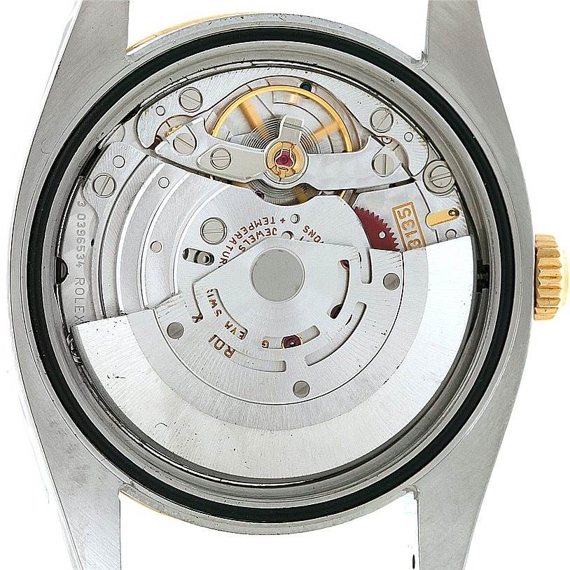 This is a close-up view of the Rolex Datejust 116203 Men's Stainless Steel Mother of Pearl Dial 116203 Men's Stainless Steel Mother of Pearl Dial watch movement and inner mechanisms from the back angle.