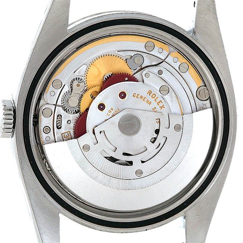 This is a close-up of the inner mechanism of a Rolex Datejust 116234 Men
s Stainless Steel White Dial 116234 Men
s Stainless Steel White Dial watch, showcasing its intricate movement components.