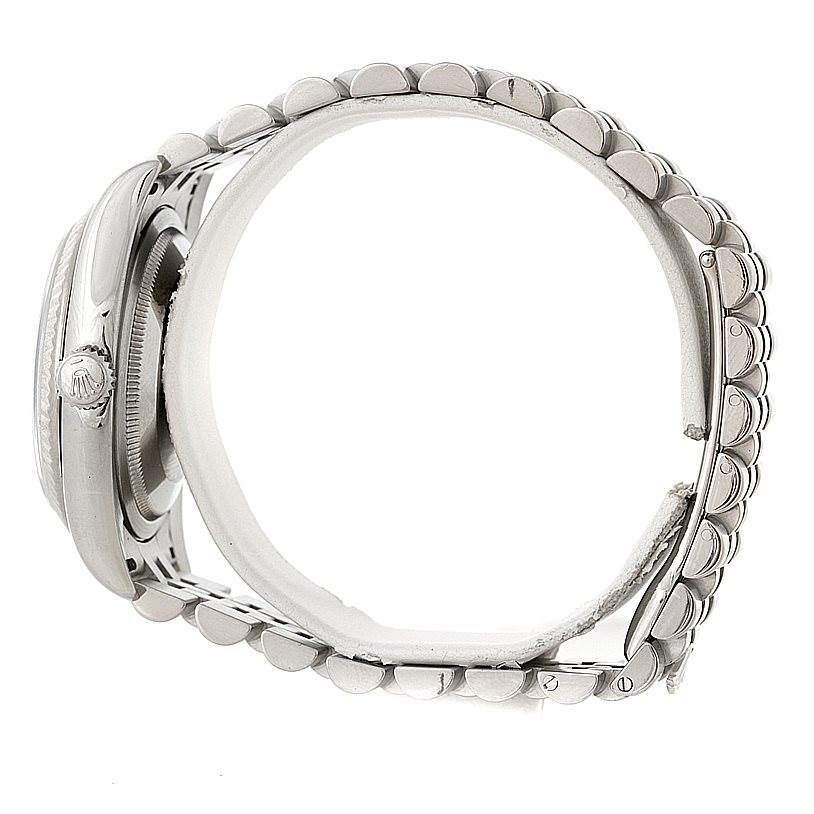 The image shows a side profile of a Rolex Datejust 116234 Men
s Stainless Steel White Dial 116234 Men
s Stainless Steel White Dial watch, highlighting the crown, case, and part of the bracelet.