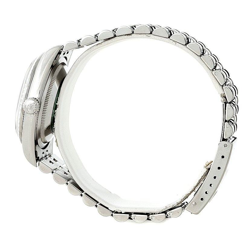 The image shows a side view of a Rolex Datejust 16220 Men
s Stainless Steel Black Dial 16220 Men
s Stainless Steel Black Dial watch, focusing on the crown, case, and bracelet.