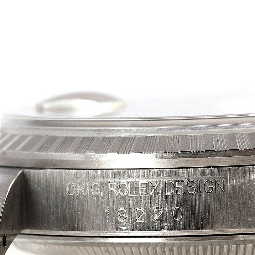 This image shows a close-up side view of a Rolex Datejust 16220 Men
s Stainless Steel Black Dial 16220 Men
s Stainless Steel Black Dial watch, highlighting the bezel and engravings on the case.
