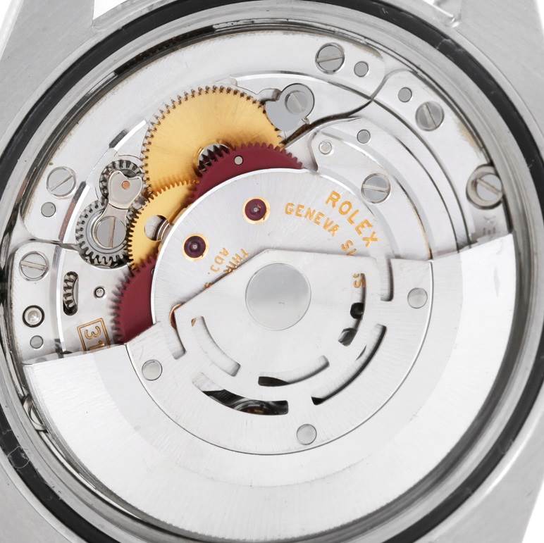 This close-up view shows the intricate movement and gears of the Rolex Datejust 116234 Men
s Stainless Steel Black Dial 116234 Men
s Stainless Steel Black Dial model from the back.