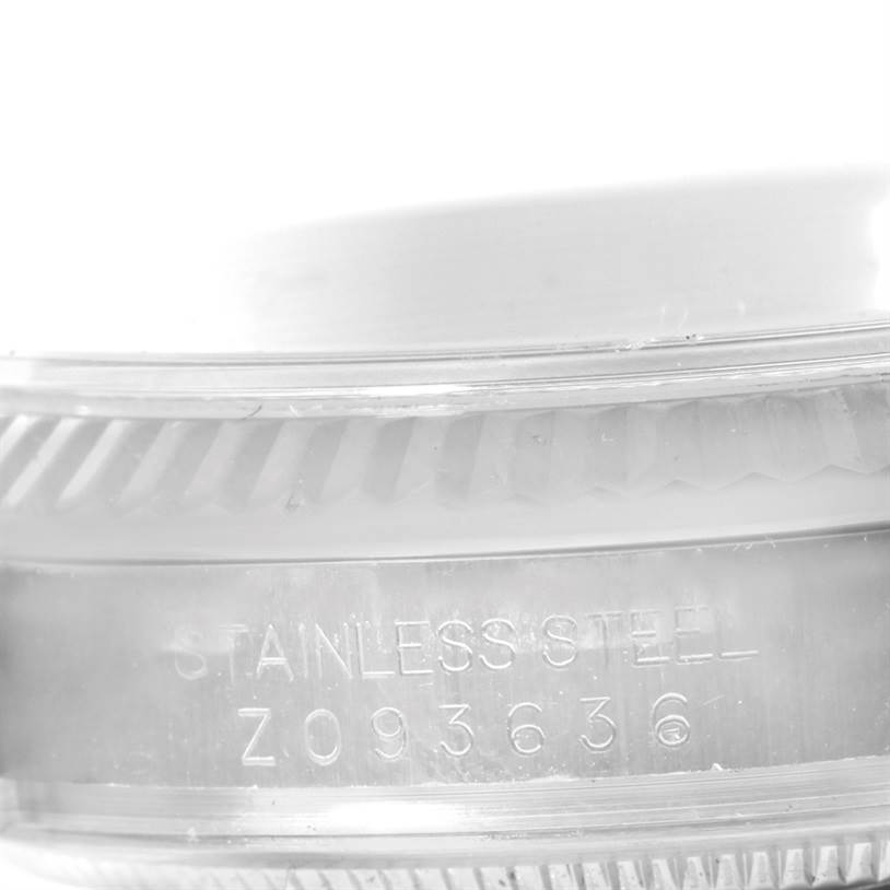 This close-up image shows the side view of a stainless steel case with serial number engraving on a Rolex Datejust 116234 Men
s Stainless Steel Black Dial 116234 Men
s Stainless Steel Black Dial.