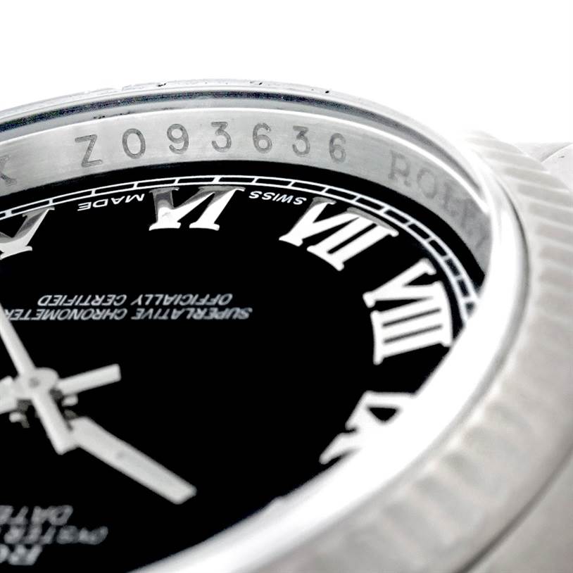 Close-up angle showing the bezel, serial number, and part of the dial with Roman numerals of a Rolex Datejust 116234 Men
s Stainless Steel Black Dial 116234 Men
s Stainless Steel Black Dial watch.