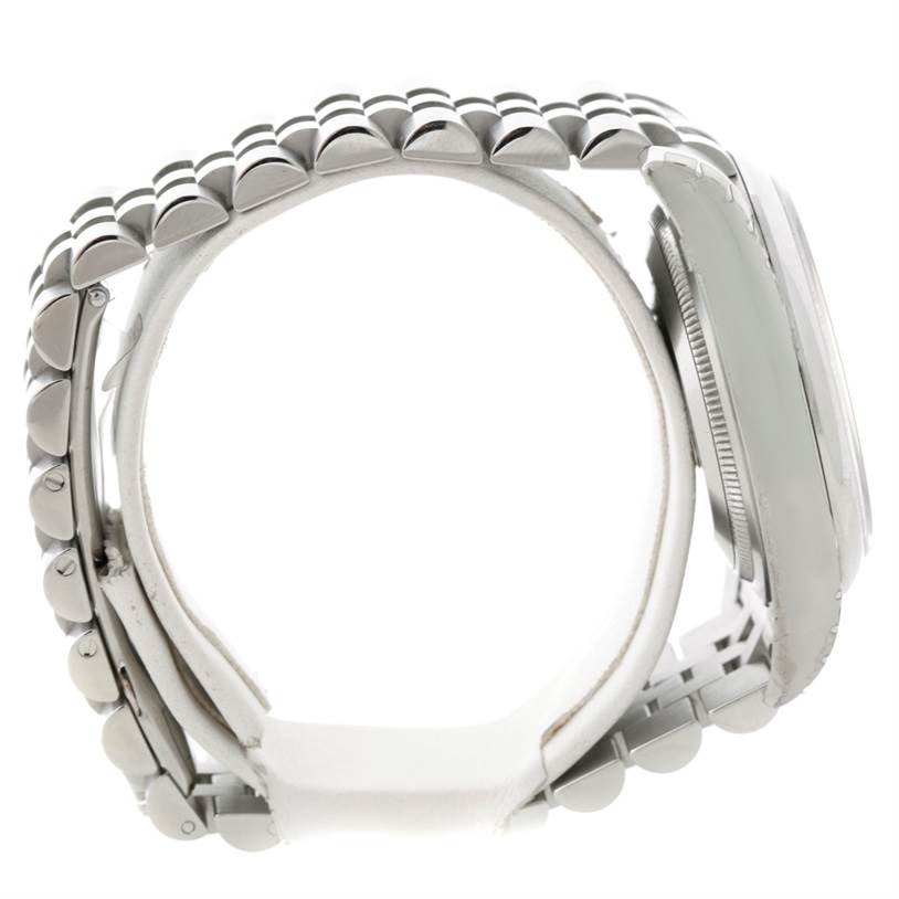 The image shows a side angle of a Rolex Datejust 116200 Men
s Stainless Steel White Dial 116200 Men
s Stainless Steel White Dial watch displaying most of the band and part of the watch case.