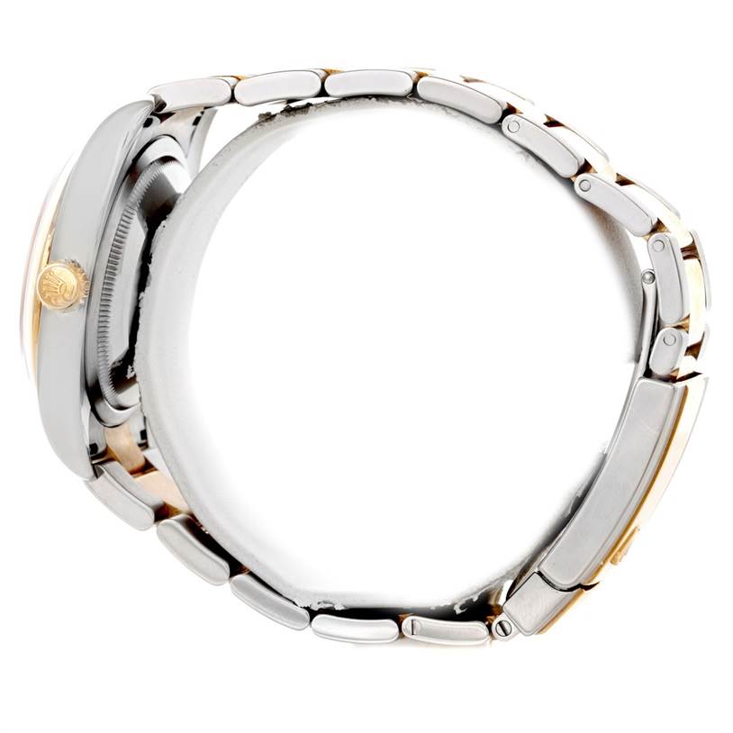 This Rolex Datejust 116203 Men's Stainless Steel Silver Dial 116203 Men's Stainless Steel Silver Dial watch is shown from the side, displaying its crown and metallic bracelet.