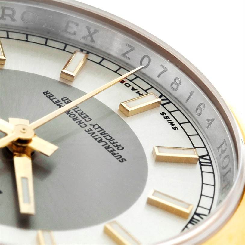 This is a close-up view of the dial and bezel of a Rolex Datejust 116203 Men's Stainless Steel Silver Dial 116203 Men's Stainless Steel Silver Dial watch, showing the serial number and part of the face.