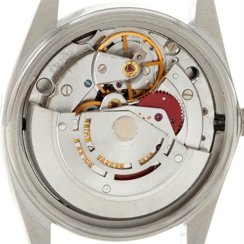 The image shows the internal mechanism of a Rolex Datejust 16013 Men's Stainless Steel Champagne Dial 16013 Men's Stainless Steel Champagne Dial watch from a rear view, displaying its intricate components.