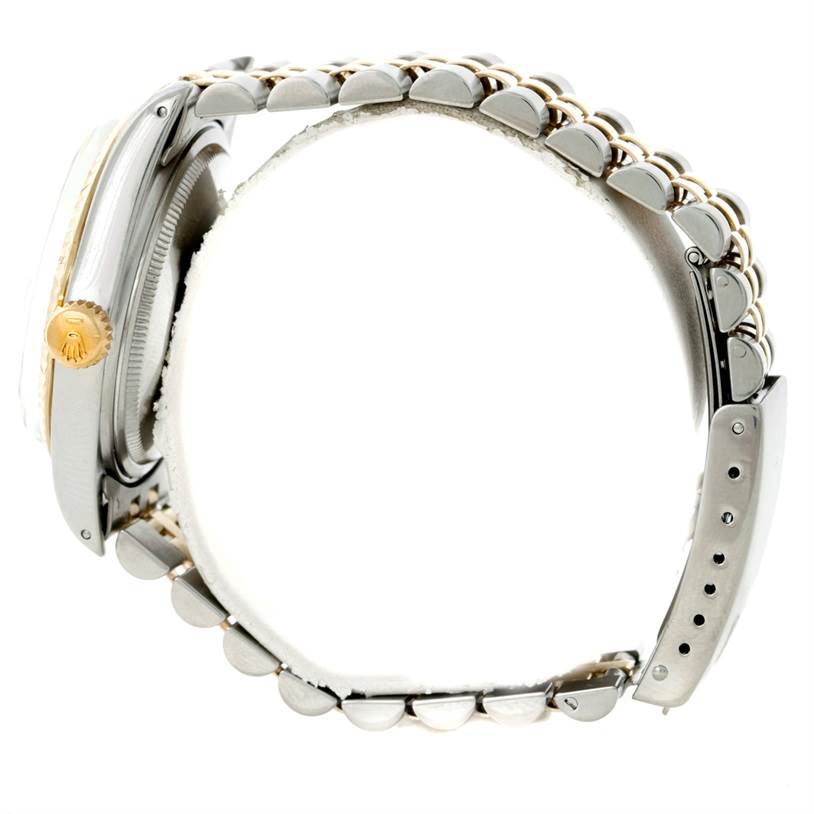 The image shows the side profile of a Rolex Datejust 16013 Men's Stainless Steel Champagne Dial 16013 Men's Stainless Steel Champagne Dial watch, highlighting the crown, case, and bracelet.