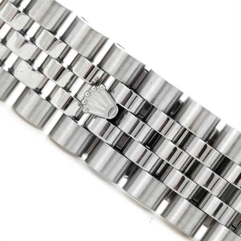 This image shows a close-up of the metal bracelet of a Rolex Datejust 116234 Men
s Stainless Steel White Dial 116234 Men
s Stainless Steel White Dial watch.