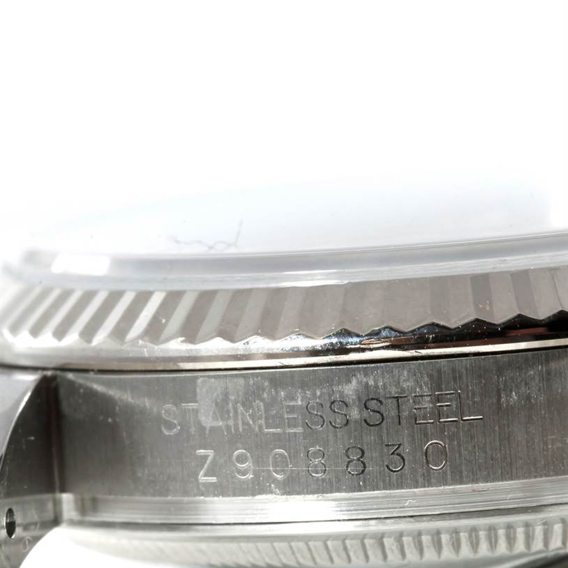This close-up image shows the side engraving and part of the bezel of the Rolex Datejust 116234 Men
s Stainless Steel White Dial 116234 Men
s Stainless Steel White Dial watch.