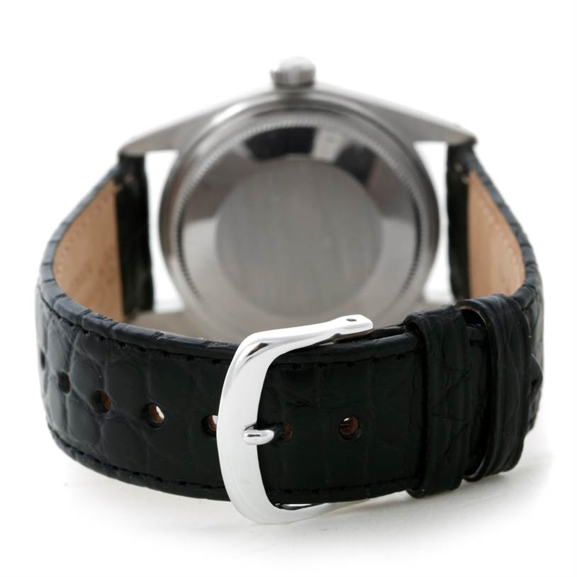 This image shows the back of a Rolex Datejust 16014 Men's Stainless Steel Blue Dial 16014 Men's Stainless Steel Blue Dial watch, highlighting its case and black leather strap with a buckle.