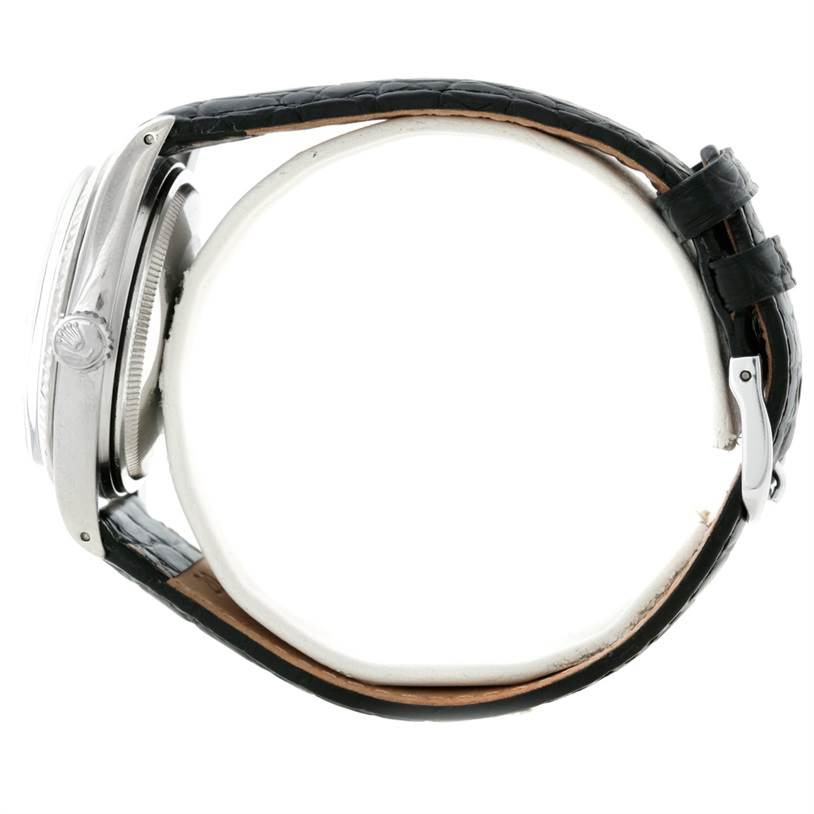 The image shows a side profile of a Rolex Datejust 16014 Men's Stainless Steel Blue Dial 16014 Men's Stainless Steel Blue Dial watch highlighting the crown, case, and black leather strap.