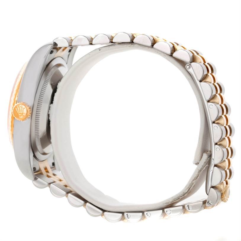 This side view of the Rolex Datejust 116233 Men
s Stainless Steel Champagne Dial 116233 Men
s Stainless Steel Champagne Dial watch shows the case, crown, and bracelet.