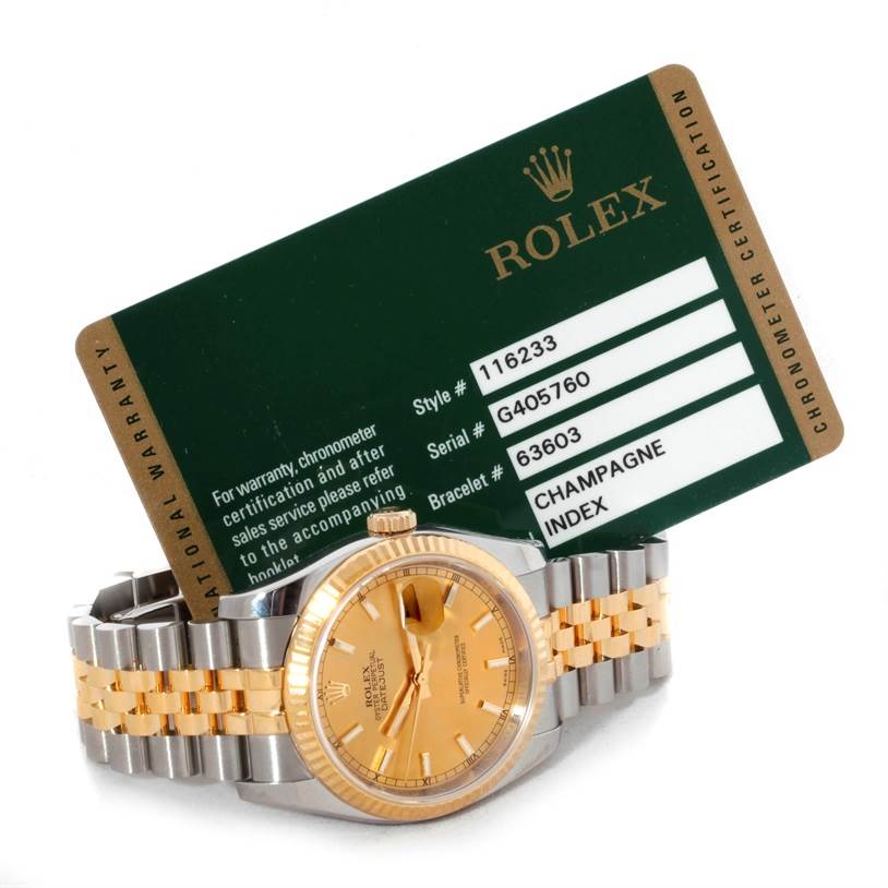 The image shows a Rolex Datejust 116233 Men
s Stainless Steel Champagne Dial 116233 Men
s Stainless Steel Champagne Dial watch with a champagne dial and jubilee bracelet, along with its chronometer certification card.