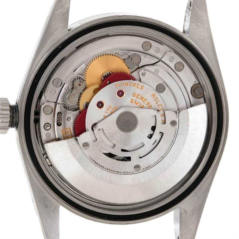 The image shows the inner mechanism of a Rolex Datejust 16220 Men's Stainless Steel Silver Dial 16220 Men's Stainless Steel Silver Dial watch viewed from the back, highlighting gears and components.