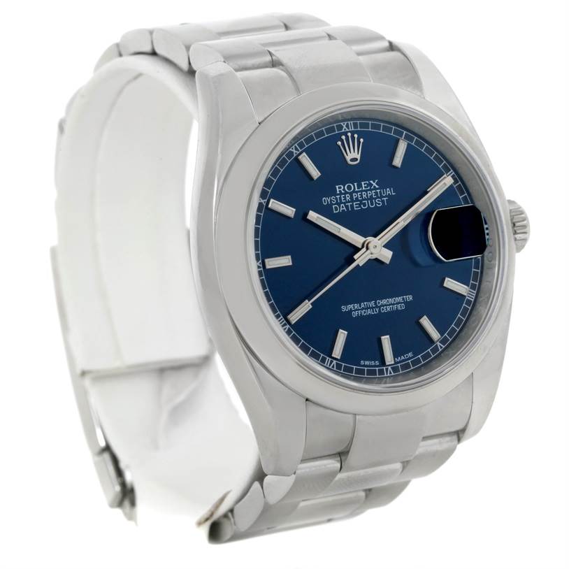 The image shows a Rolex Datejust 116200 Men's Stainless Steel Blue Dial 116200 Men's Stainless Steel Blue Dial watch with a blue dial, seen from a slight angle, showcasing its face, bezel, and bracelet.