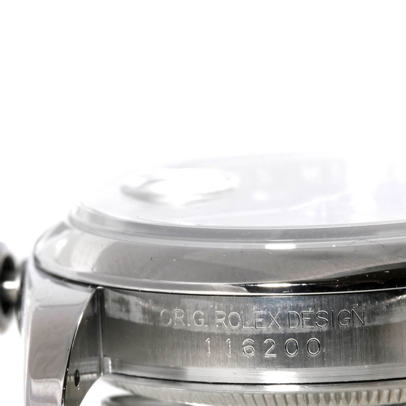 The image shows a side view of a Rolex Datejust 116200 Men
s Stainless Steel Black Dial 116200 Men
s Stainless Steel Black Dial watch, focusing on the case and model number 116200 engraving.