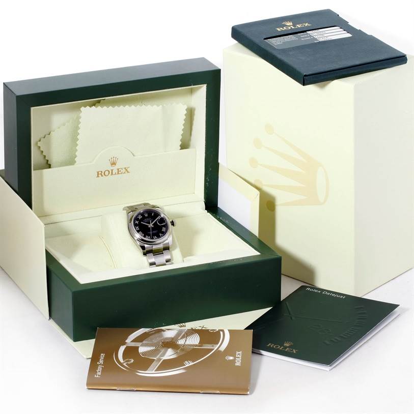 The image shows a Rolex Datejust 116200 Men
s Stainless Steel Black Dial 116200 Men
s Stainless Steel Black Dial watch in an open presentation box with documentation and accessories.