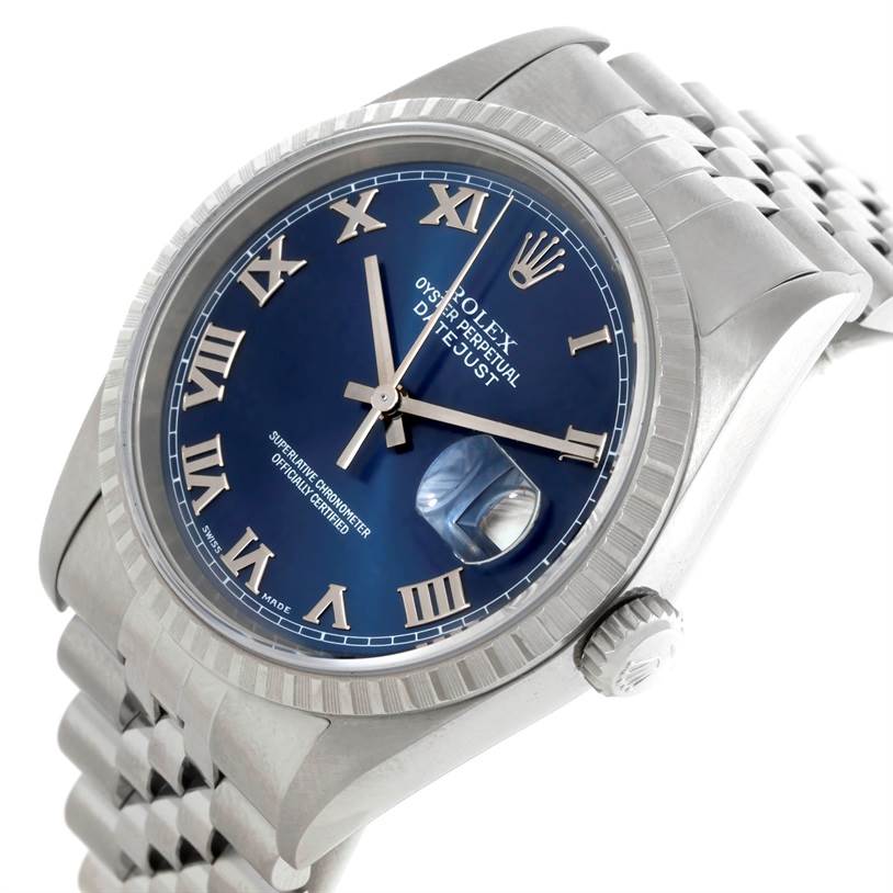 This Rolex Datejust 16220 Men's Stainless Steel Blue Dial 16220 Men's Stainless Steel Blue Dial watch is shown at an angled view highlighting the blue dial, Roman numerals, date magnifier, and part of the bracelet.