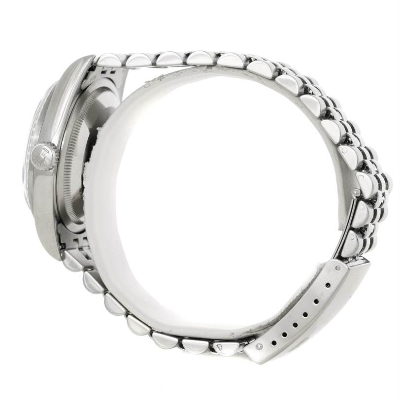 This image shows a side view of the Rolex Datejust 16220 Men's Stainless Steel Blue Dial 16220 Men's Stainless Steel Blue Dial watch, highlighting the bracelet, bezel, and side case. 