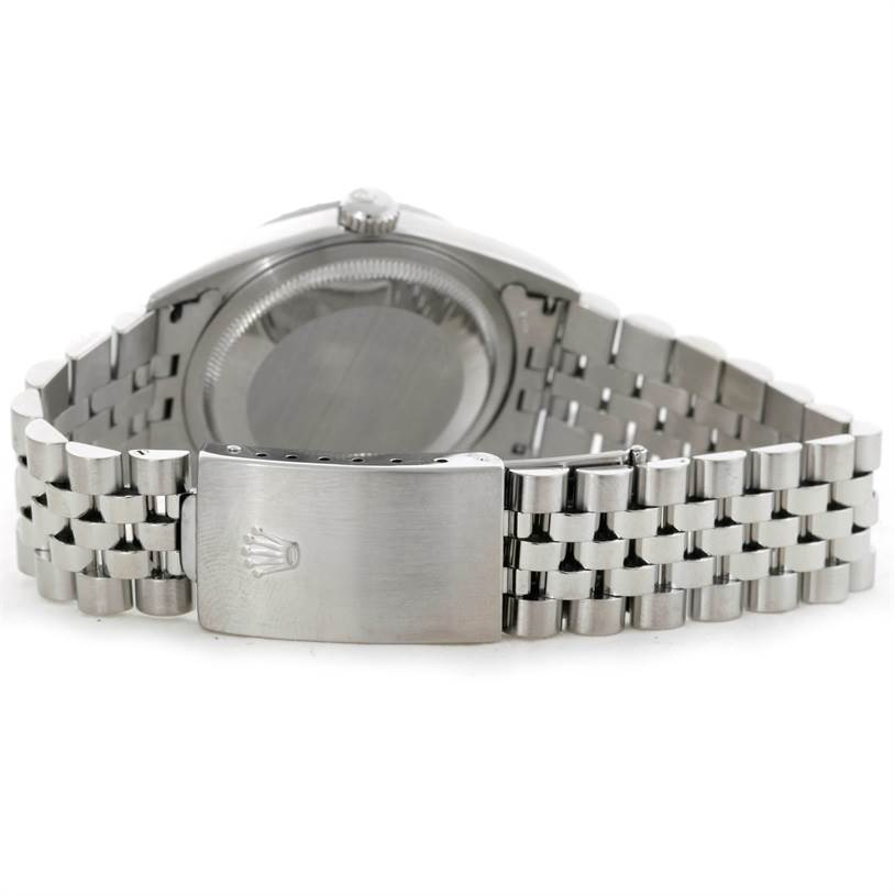 The image shows the back view of a Rolex Datejust 16220 Men's Stainless Steel Blue Dial 16220 Men's Stainless Steel Blue Dial watch, highlighting its stainless steel case and Jubilee bracelet with a clasp.