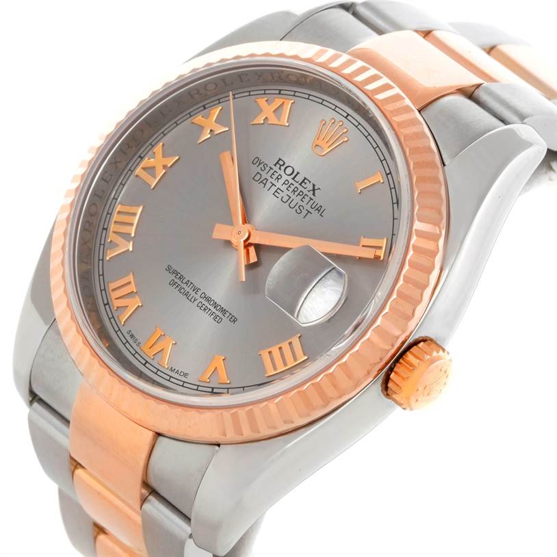 This image shows a Rolex Datejust 116231 Men's Steel and Gold (two tone) Pink Dial 116231 Men's Steel and Gold (two tone) Pink Dial watch at an angled close-up, highlighting the face, bezel, and part of the two-tone bracelet.