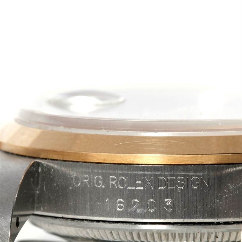 This image shows a close-up side angle of the case of a Rolex Datejust 16203 Men's Steel and Gold (two tone) Silver Dial 16203 Men's Steel and Gold (two tone) Silver Dial watch model, revealing the model and brand engravings.