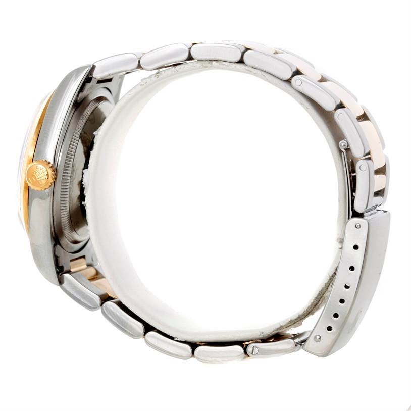 The image shows a side view of a Rolex Datejust 16203 Men's Steel and Gold (two tone) Silver Dial 16203 Men's Steel and Gold (two tone) Silver Dial watch, highlighting the case, crown, and part of the bracelet.