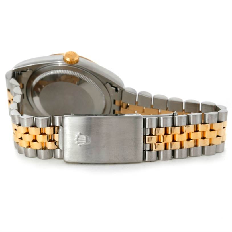 The image shows the back case and Jubilee bracelet clasp of a Rolex Datejust 16233 Men's Steel and Gold (two tone) Champagne Dial 16233 Men's Steel and Gold (two tone) Champagne Dial watch, featuring a two-tone design in silver and gold.