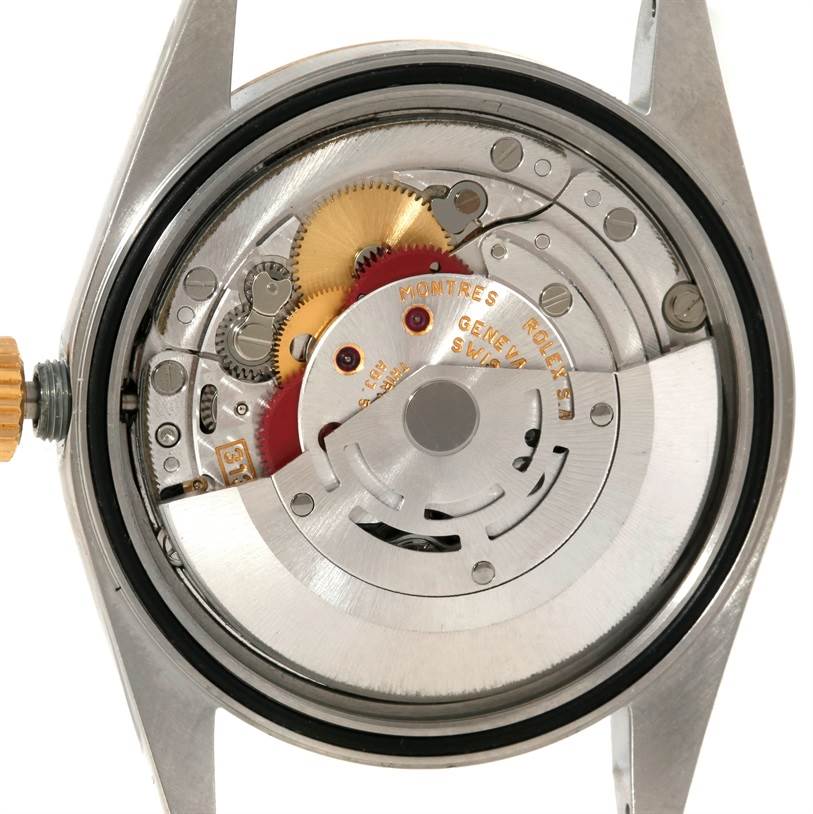 The image shows a close-up of the movement and internal mechanics of a Rolex Datejust 16233 Men's Steel and Gold (two tone) Champagne Dial 16233 Men's Steel and Gold (two tone) Champagne Dial watch from the back.