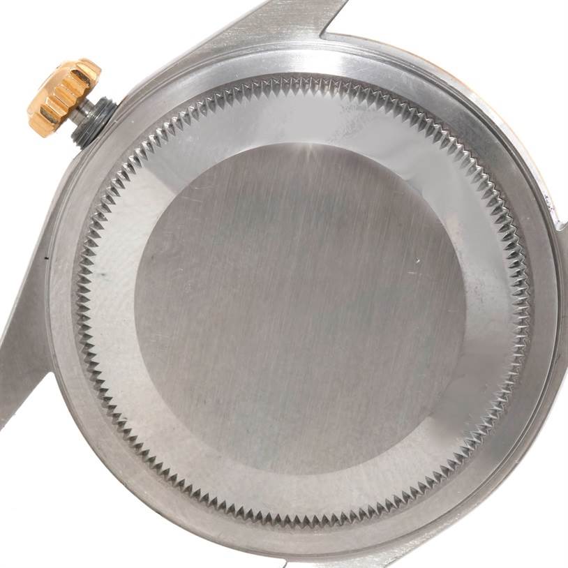 This image shows the case back and crown of a Rolex Datejust 16233 Men's Steel and Gold (two tone) Champagne Dial 16233 Men's Steel and Gold (two tone) Champagne Dial watch from a close-up angle.