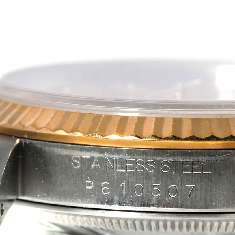 The image shows a close-up side view of the case, bezel, and part of the crystal of a Rolex Datejust 16233 Men's Steel and Gold (two tone) Champagne Dial 16233 Men's Steel and Gold (two tone) Champagne Dial watch.