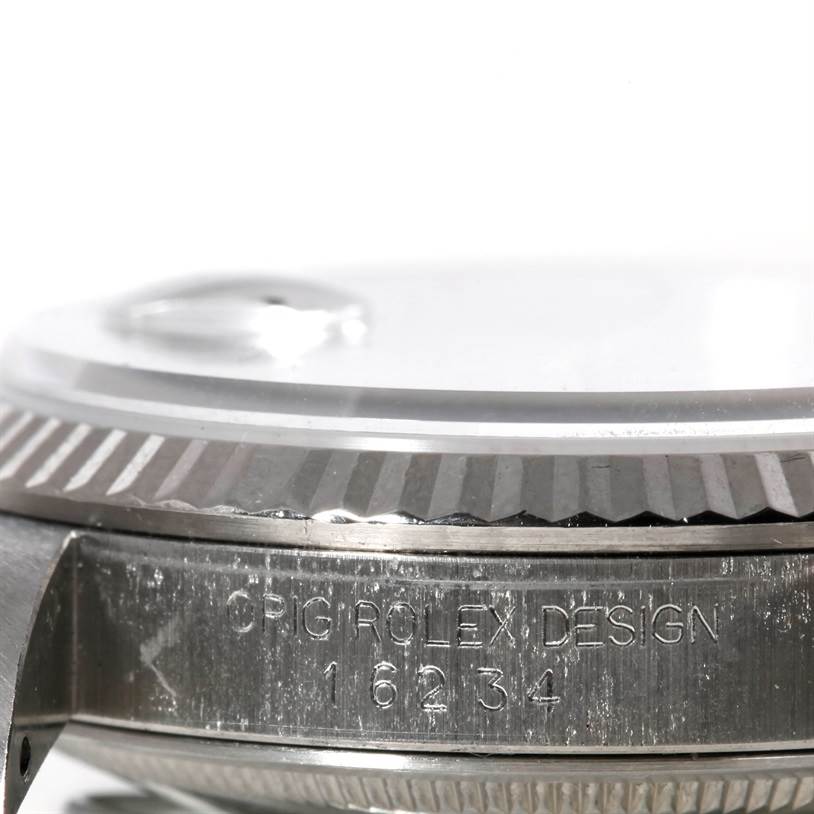 This image shows the side view of a Rolex Datejust 16234 Men's Stainless Steel Silver Dial 16234 Men's Stainless Steel Silver Dial watch case, highlighting the bezel and the engraved model number 16234.